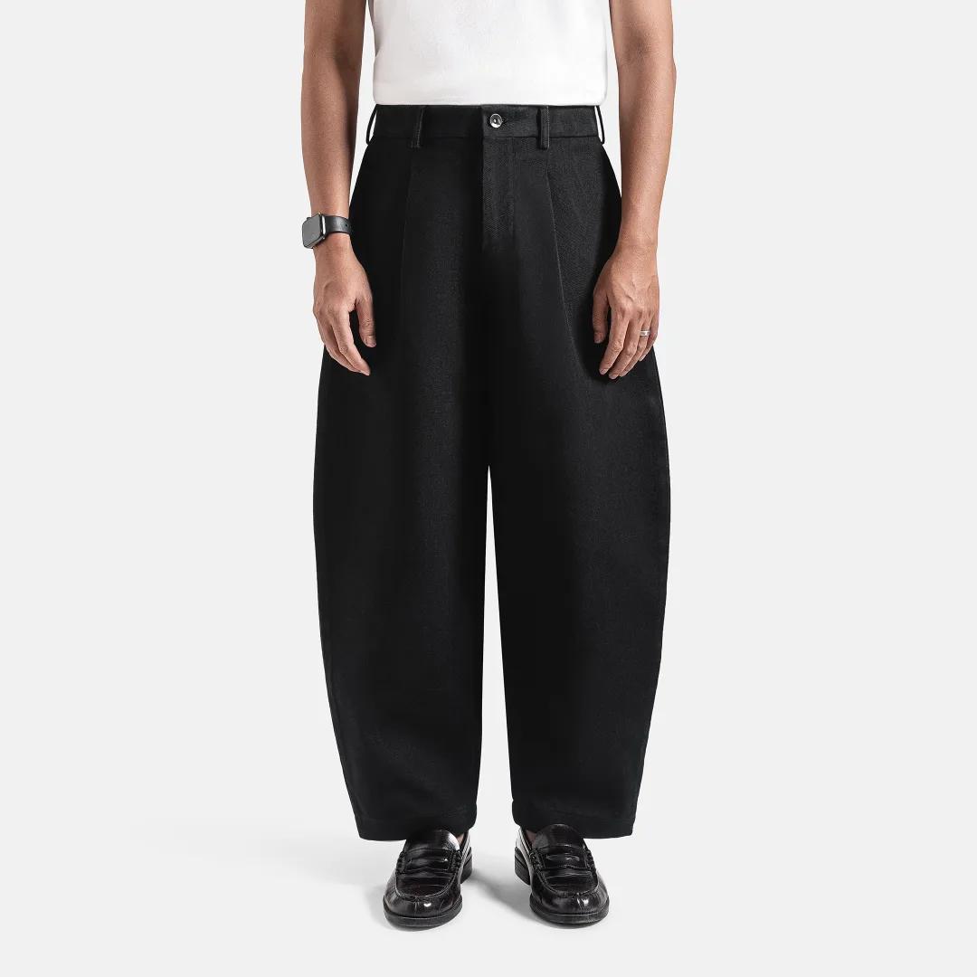 Straight versus barrel: men's black jeans in a barrel cut