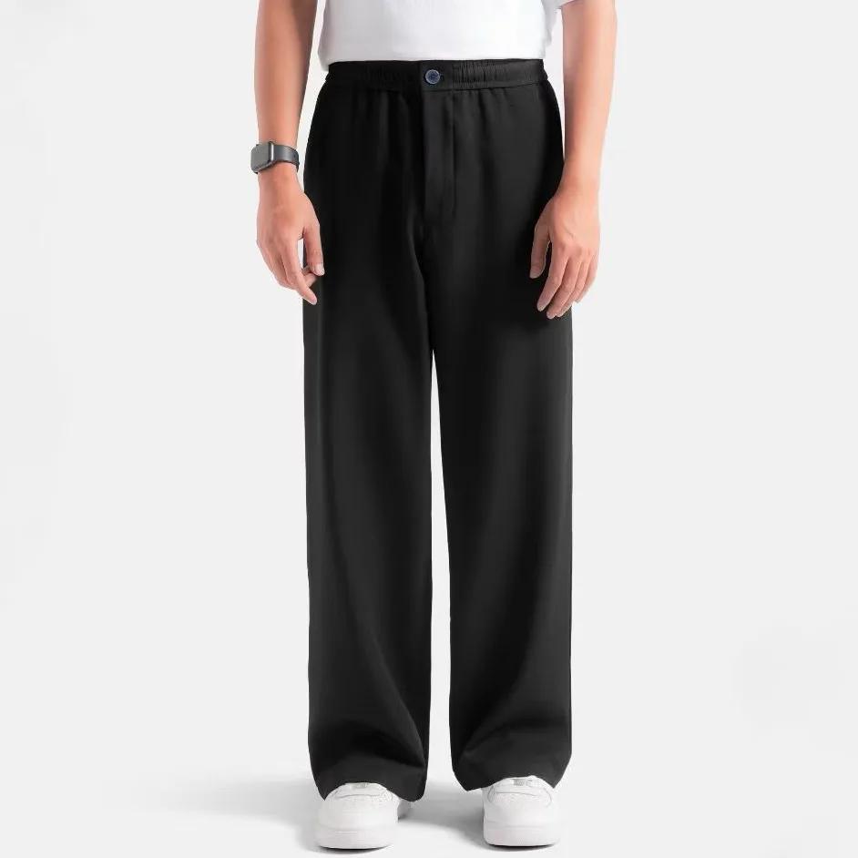 Black men's loose pants with an elastic waist, an alternative to baggy pants